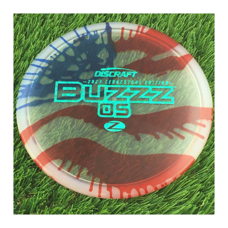 Discraft Elite Z Fly-Dyed BuzzzOS with 2023 Ledgestone Edition - Wave 2 Stamp - 180g - Translucent Flag