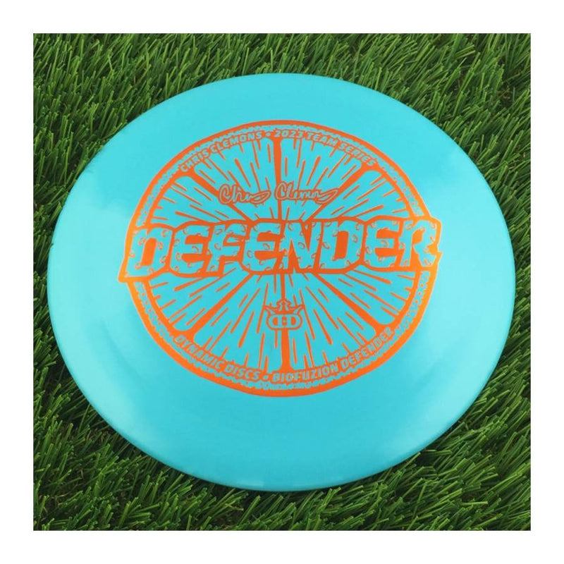 Dynamic Discs BioFuzion Defender with Chris Clemons Lemon Seeds Team Series 2023 Stamp - 171g - Solid Blue