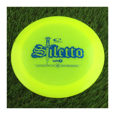 Latitude 64 Opto-X Stiletto with 10 Year Anniversary Sword Stamp - 174g - Translucent Yellow