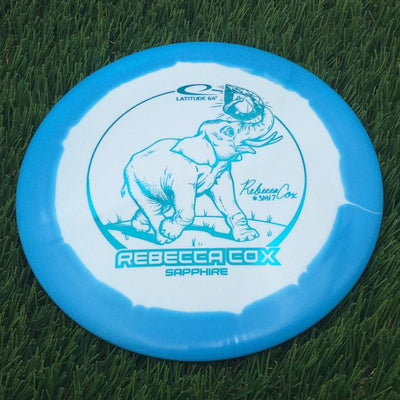 Latitude 64 Gold Line Orbit Sapphire with Rebecca Cox Team Series 2024 Stamp- 162 Blue