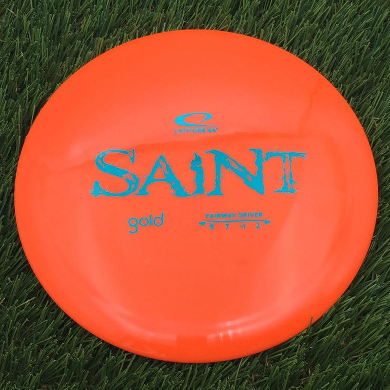 Latitude 64 Gold Line Saint with Distressed Stock Stamp- 175.07 Orange