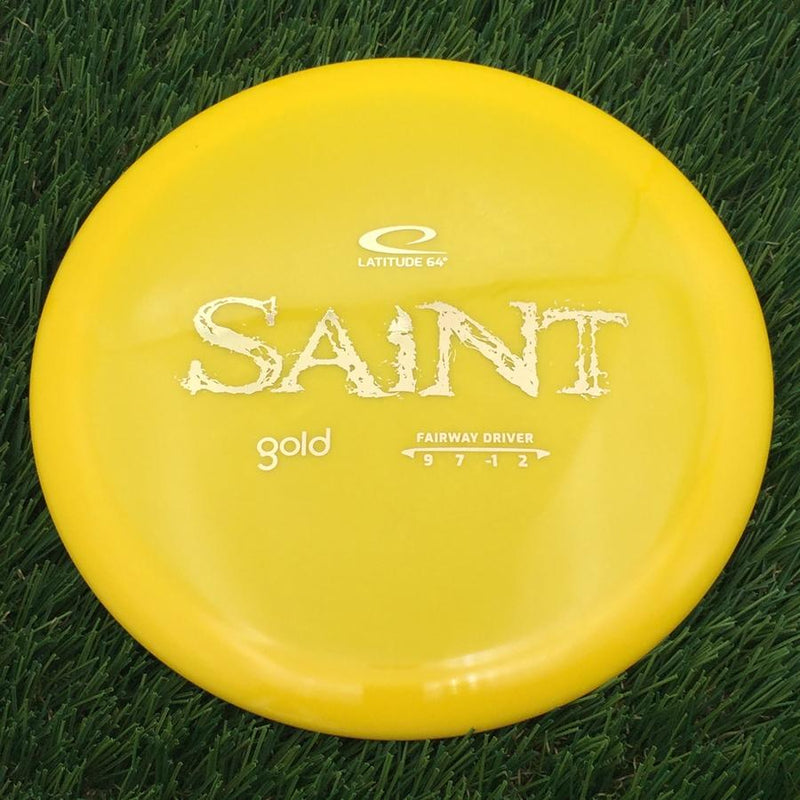 Latitude 64 Gold Line Saint with Distressed Stock Stamp- 173.17 Yellow