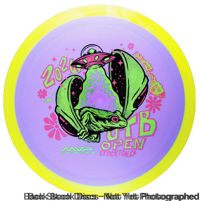 Axiom Fission Delirium disc golf disc with a vibrant alien frog and UFO artwork on a purple and yellow disc.