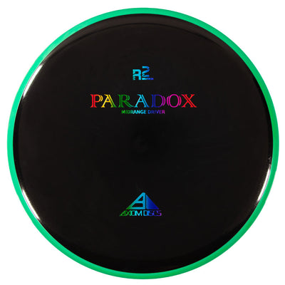 Black Axiom Neutron Paradox Midrange Driver disc golf disc with a vibrant green rim and rainbow foil stamping.