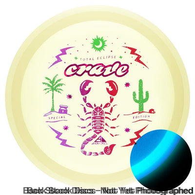 Yellow Axiom Total Eclipse Crave disc with purple and red scorpion art, a green palm tree, and a green cactus.