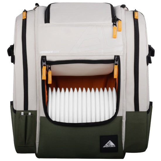 Axiom voyager lite disc golf backpack in cream and olive green, with orange zipper pulls and white discs visible.