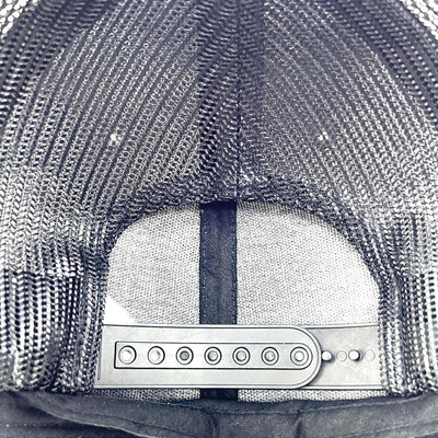 Black Axiom Yupoong snapback trucker hat with a dark gray mesh back and adjustable black plastic snap closure.