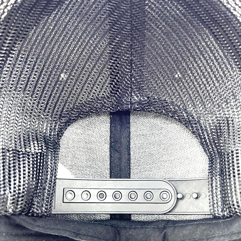 Black Axiom Yupoong snapback trucker hat with a dark gray mesh back and adjustable black plastic snap closure.