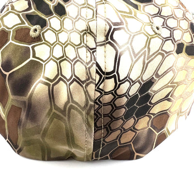 A Yupoong Axiom Flexfit hat in brown, green, and black Kryptek Pyramid camouflage with matching top buttons.