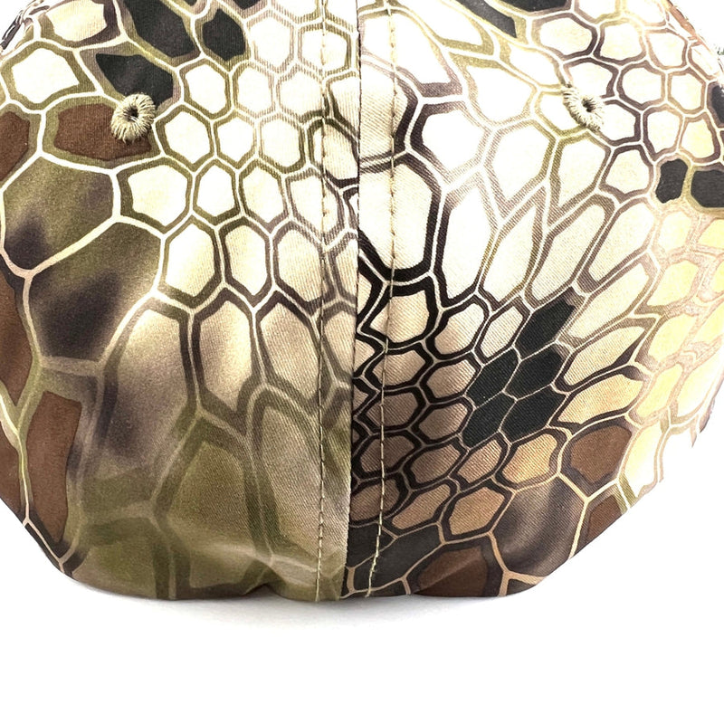 A Yupoong Axiom Flexfit hat in brown, green, and black Kryptek Pyramid camouflage with matching top buttons.