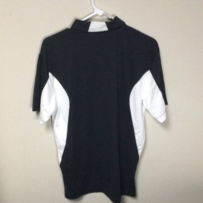 Back of a black mvp orbit logo polo with white side panels and a white collar accent, hanging on a hanger.