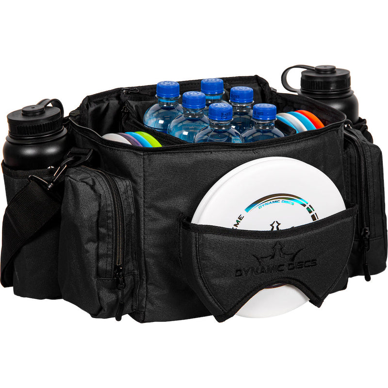Black dynamic discs soldier cooler bag filled with water bottles and discs, with two black water bottles in side pockets.
