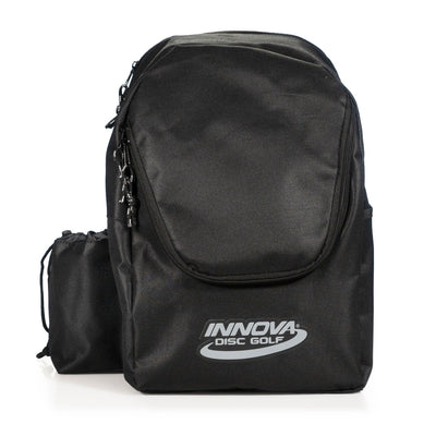 Black innova discover disc golf bag with a small drawstring pouch, visible zippers, and the innova logo.