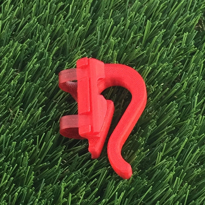 Red Briggisware Zuca Cart single putter holder made of 3D printed plastic, featuring a curved hook and a clamp.
