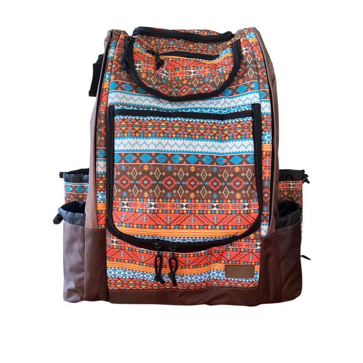 Carbella Designs backpack disc golf bag in an Aztec pattern featuring orange, blue, and brown with zippered pockets.