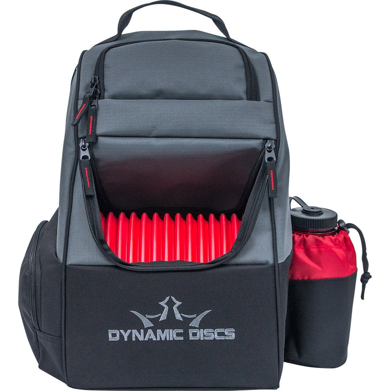 Charcoal and black dynamic discs trooper backpack disc golf bag with a row of red discs visible, and a red and black water.
