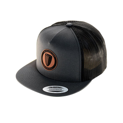 Charcoal flatbill snapback hat featuring a black mesh backing and a brown circular DGA leather patch.