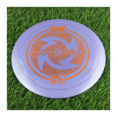 Solid purple DGA Proline Hypercane disc golf driver with an orange "Hypercane" stamp and a swirling design.