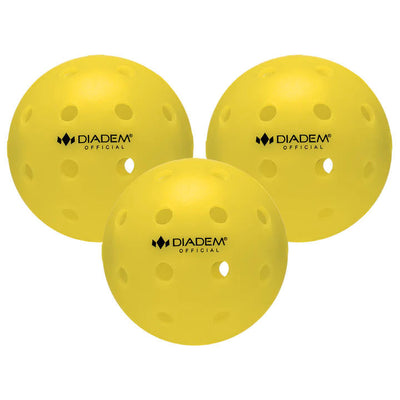 Collection of three bright yellow Diadem Official pickleballs with small circular holes scattered across their surfaces.