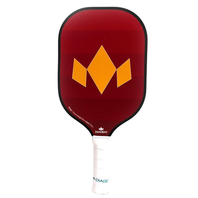 Diadem Team pickleball paddle with a red face, a bold orange diamond crown graphic, and a white grip.
