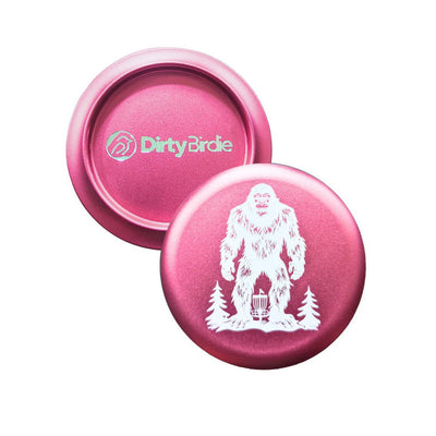 Pink Dirty Birdie aluminum metal marker with an embossed white Sasquatch and pine tree design.