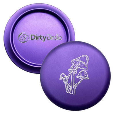 Two round purple Dirty Birdie aluminum metal markers, one featuring the brand logo and the other a white mushroom graphic.