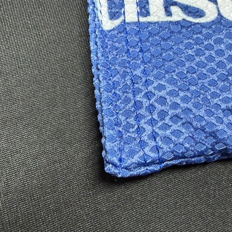 Blue Discmania bar logo Sportsack grip bag with a white logo and absorbent waffle weave material.