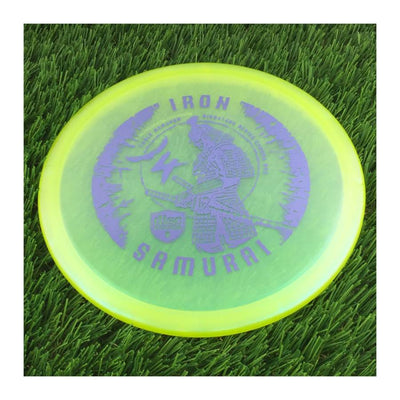 Translucent yellow Discmania Chroma C-Line MD3 disc with a purple Iron Samurai 4 eagle McMahon signature series stamp.