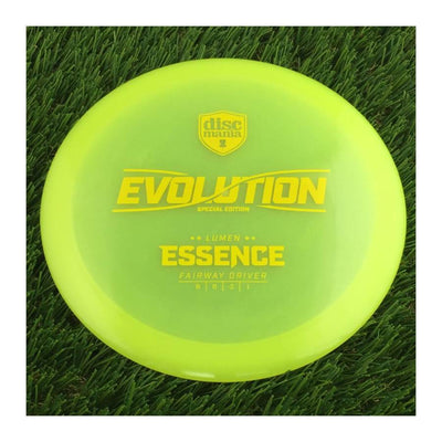 Translucent yellow Discmania Evolution Lumen Essence Fairway Driver disc golf disc with a special edition stamp.