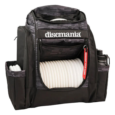 Black and gray Discmania Fanatic Sky backpack with white discs inside and a water bottle in a side pocket.