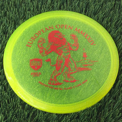 Translucent yellow Discmania MD4 disc golf disc with a red European Open MMXXIV lion stamp.