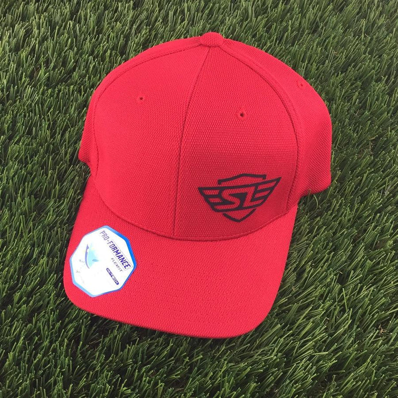 Red Flexfit hat featuring the “SL” Simon Lizotte embroidered logo in black on the front.