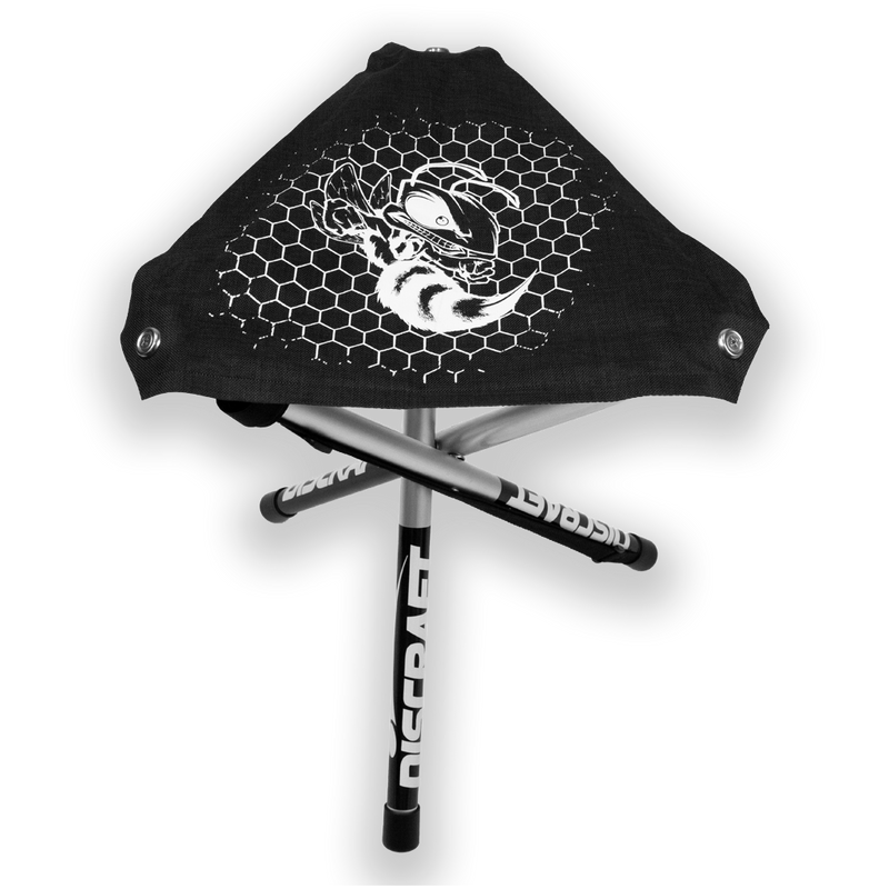 Black Discraft tripod stool with a white Hornet logo and honeycomb pattern on the fabric seat.