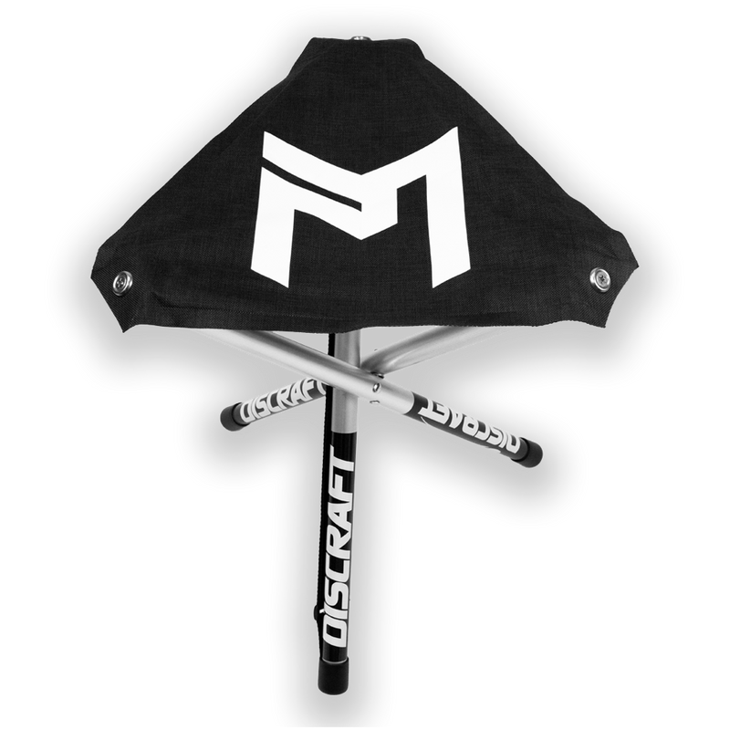 Black Discraft tripod stool with a white logo on the seat and aluminum legs featuring the Discraft brand name.