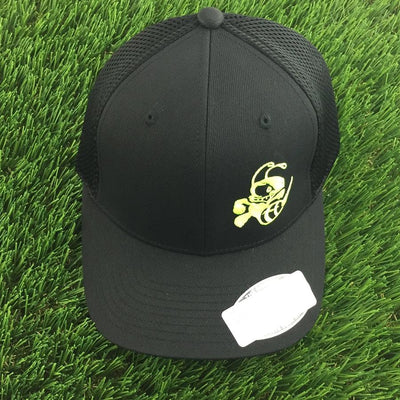 Black Discraft Buzz cap with a yellow embroidered logo, mesh back, Flexfit, and a curved bill.