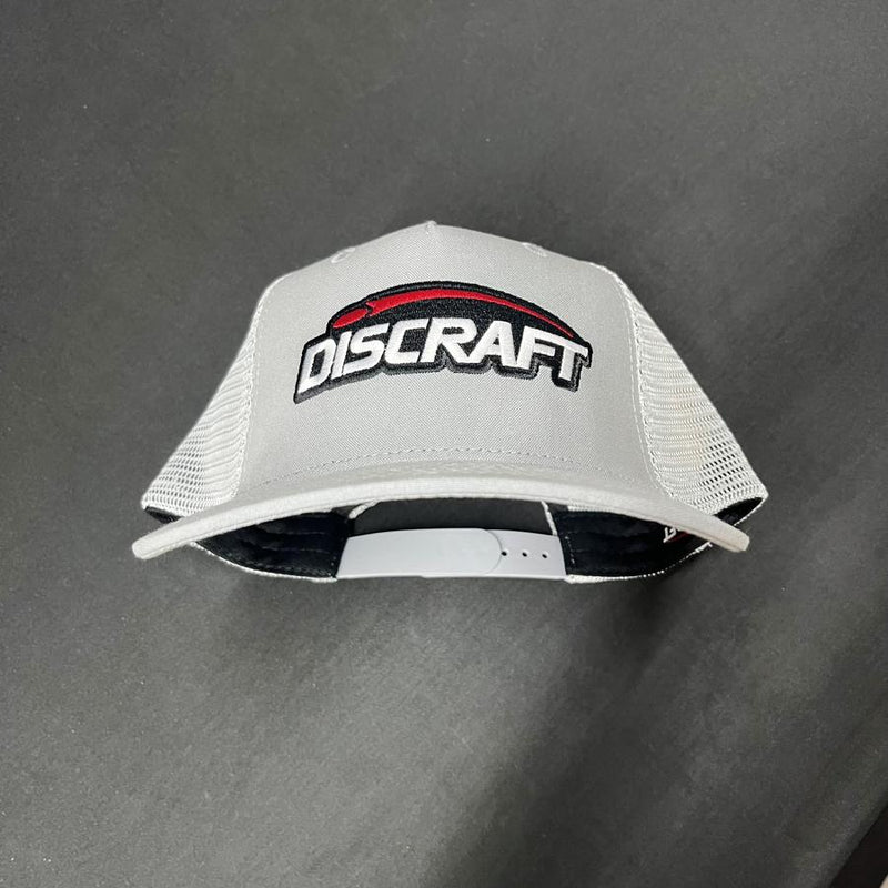 Light grey Discraft embroidered logo mesh snapback hat with a white curved brim and solid black underside.