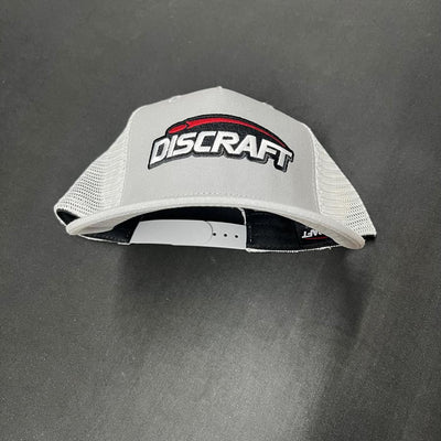 Light gray Discraft embroidered logo mesh snapback hat with a white adjustable strap and curved brim.