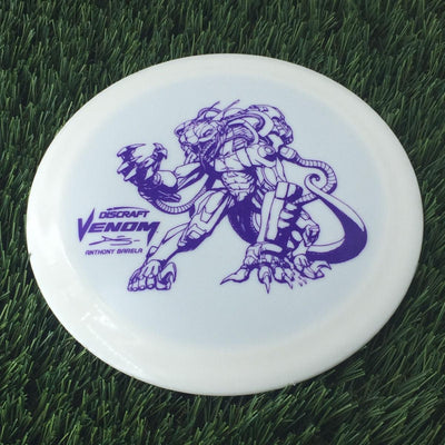 Solid white Discraft ESP Glo Venom disc with a purple limited edition Anthony Barela Mecha Viper stamp.