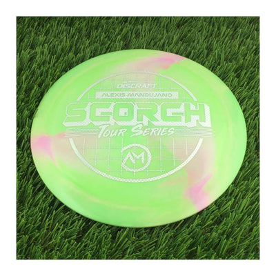 Discraft ESP Swirl Scorch disc golf disc, predominantly green with pink swirls and a white Tour Series stamp.