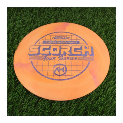 Solid orange Discraft ESP Swirl Scorch with a 2022 Alexis Mandujano Tour Series stamp in dark blue.