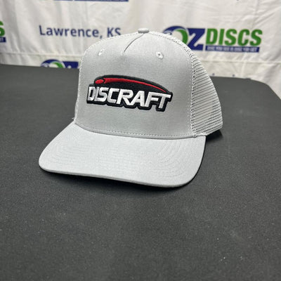 Light grey Discraft mesh snapback hat with a red and black embroidered logo on the front panel.