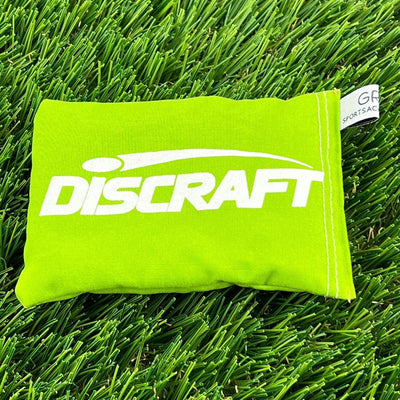 Lime green Discraft Sportsack with white brand lettering and a small fabric tag on the side.