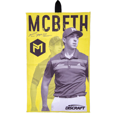 Bright yellow Discraft Paul McBeth microfiber disc golf towel with a black image of McBeth and his signature.