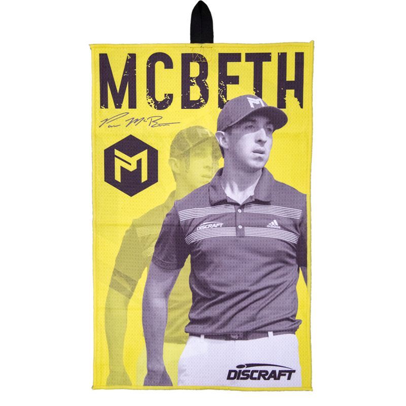 Bright yellow Discraft Paul McBeth microfiber disc golf towel with a black image of McBeth and his signature.