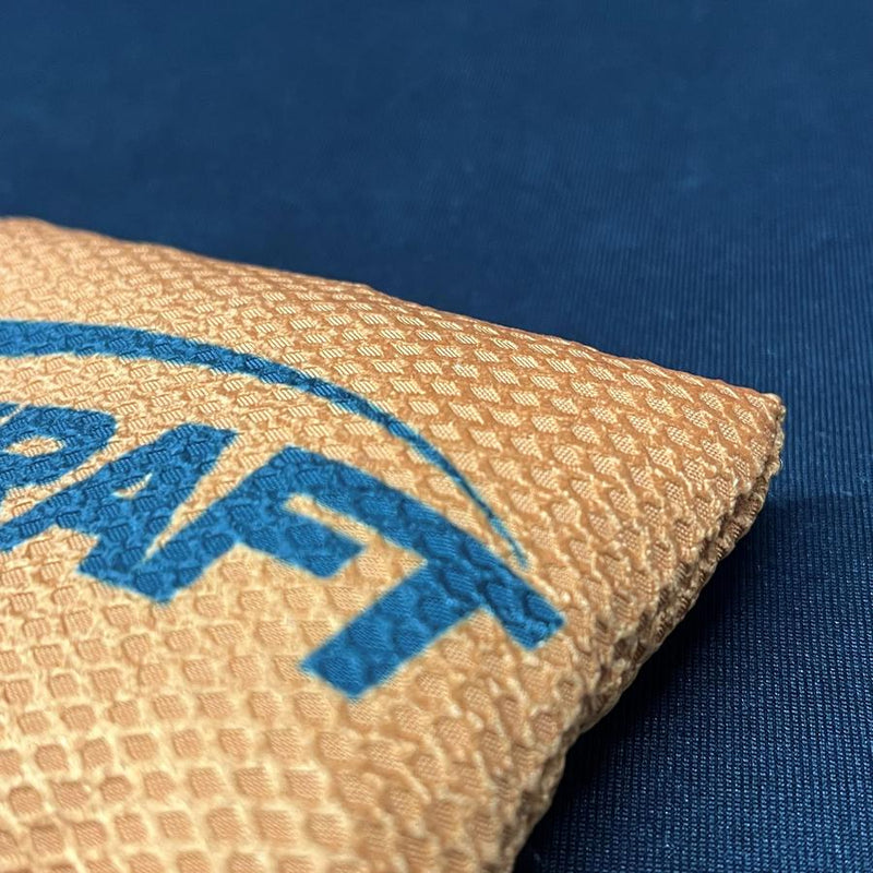 Tan Discraft Silky Feel Waffle Sportsack with a textured surface and a partial blue logo.