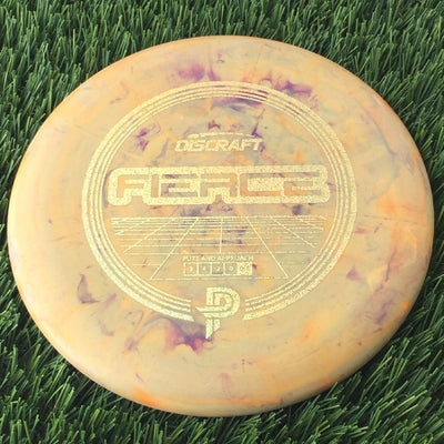 Solid dark orange Discraft Swirl Fierce disc with a metallic gold stock stamp featuring the PP logo.
