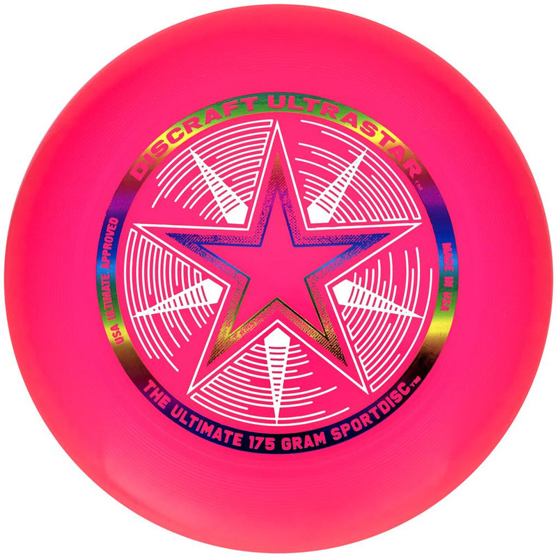 Hot pink Discraft Ultra-Star Ultimate disc with a central white star over a rainbow foil ring.