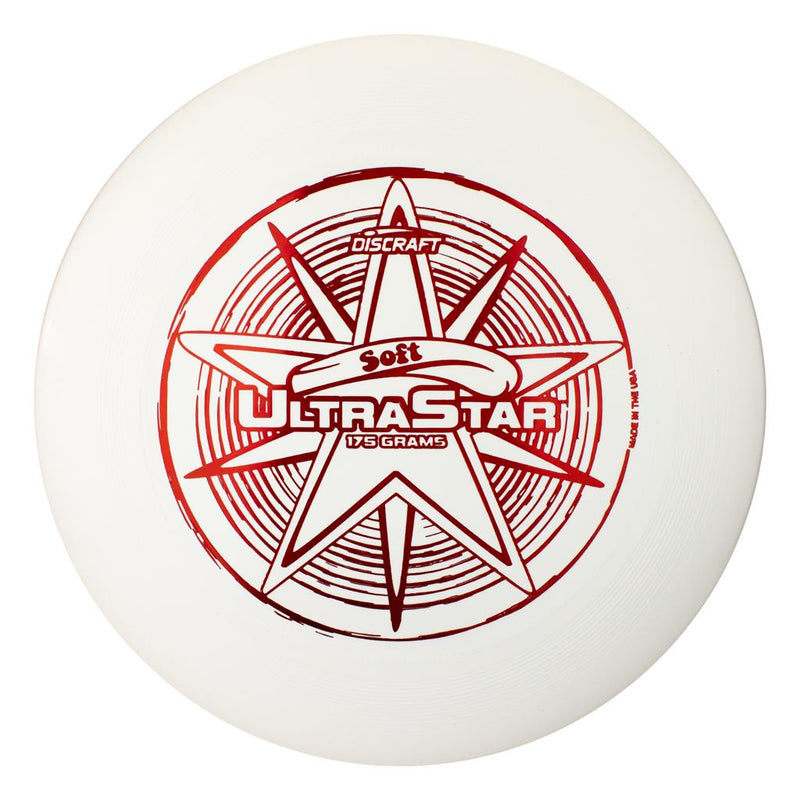 White Discraft Ultra-Star Soft frisbee with a metallic red five-point star logo and radial lines.