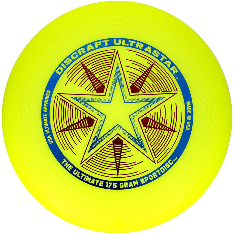 Bright yellow Discraft Ultrastar frisbee with a blue and red star motif, USA Ultimate Approved branding.