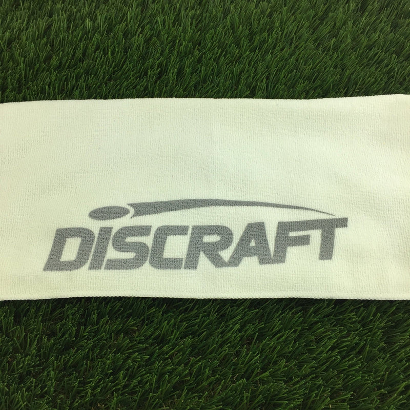 White microfiber towel with a gray Discraft logo printed prominently in the center.